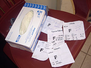 Patient papers by a package of medical gloves